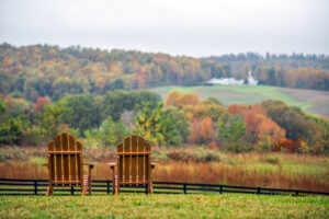 two lawn chairs look out on the mountains around Boone NC in the fall